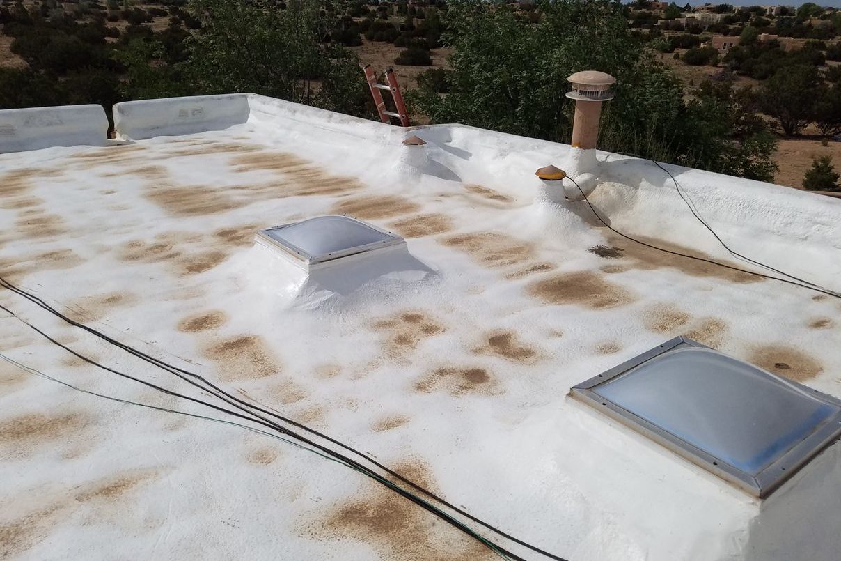 Spray foam roof repair on an existing SPF roof in Eldorado, New Mexico