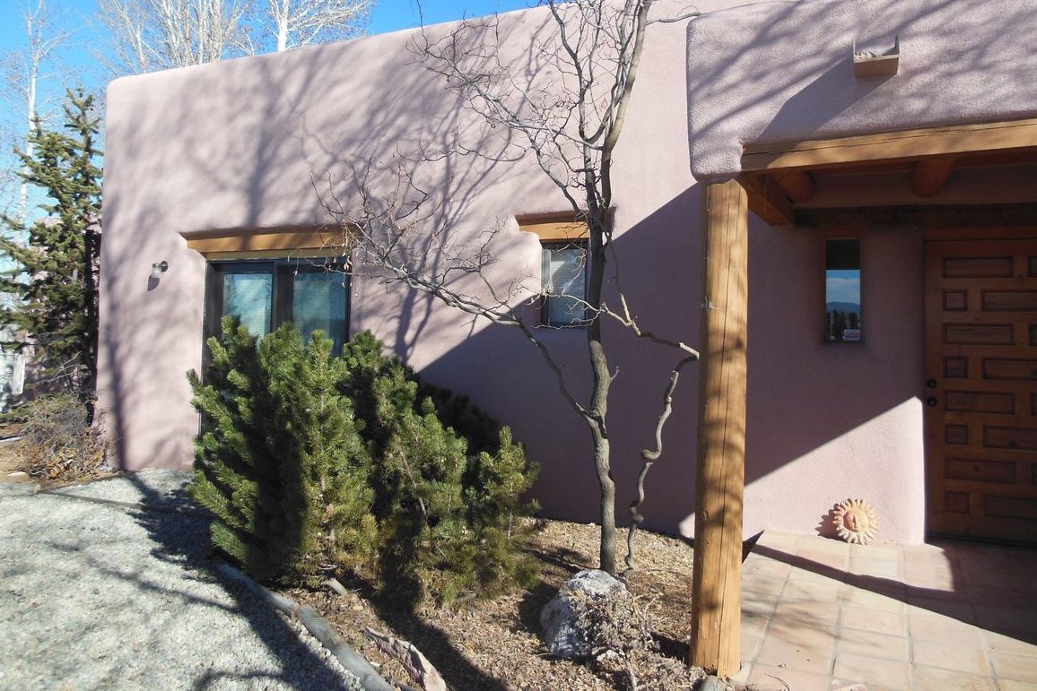 Taos estate with a new finish stucco over spray foam walls